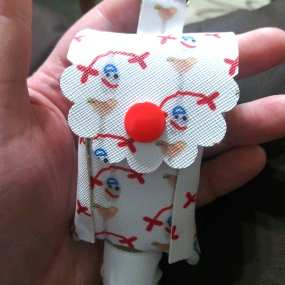 Sporke character hand sanitizer holder